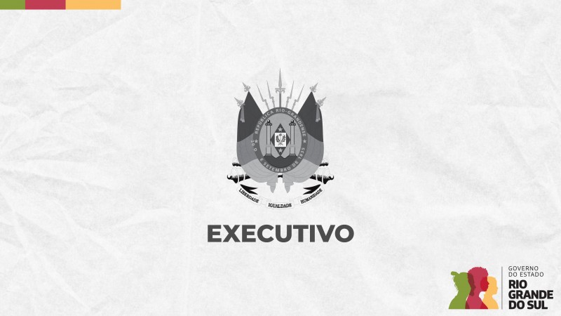 Card em fundo cinza, no qual está escrito Executivo ao centro, logo abaixo do brasão do Estado do Rio Grande do Sul. No canto inferior direito do Card está a logomarca utilizada pela gestão 2023-2026 do governo do Rio Grande do Sul.